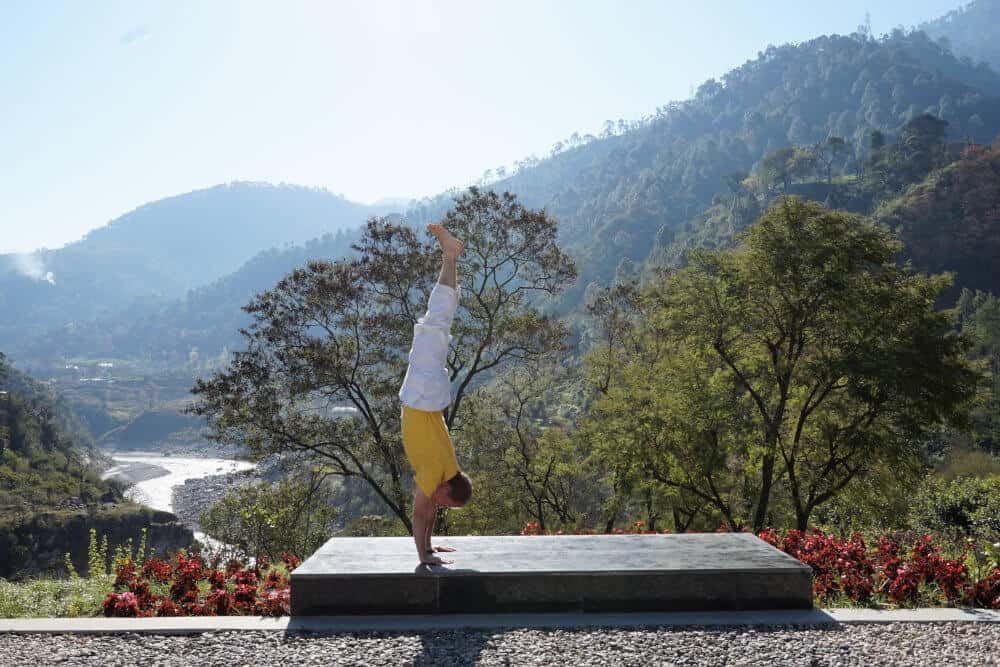 A yogi doing the Handstand in Rudraprayag, Himalayas