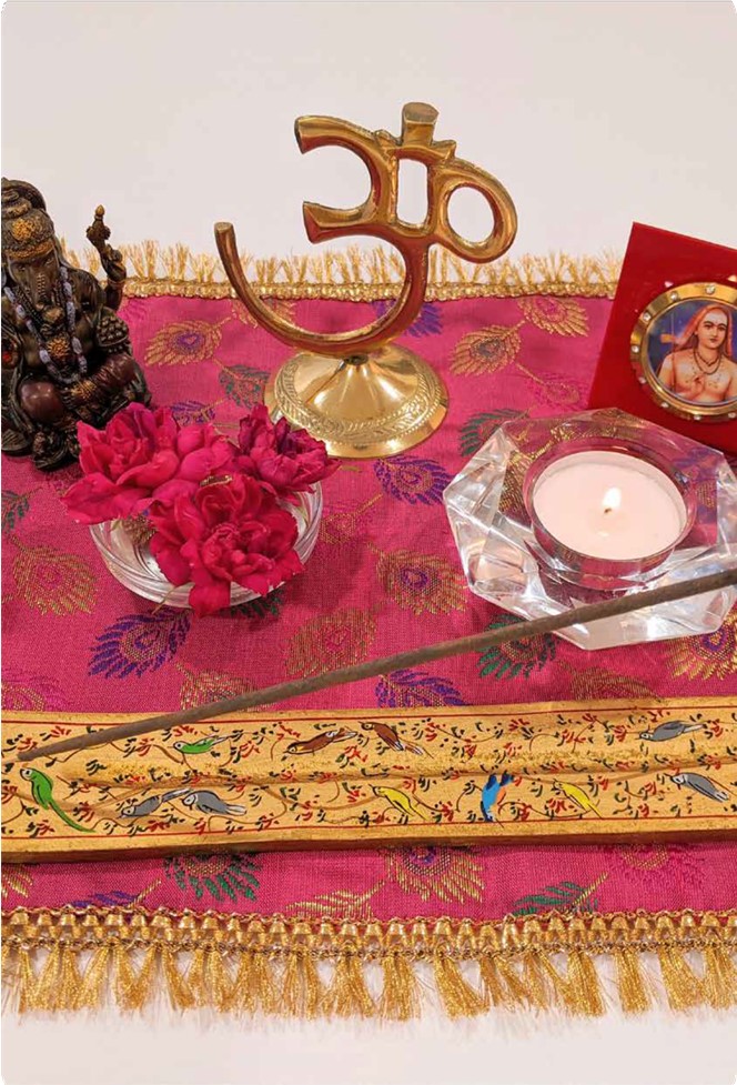 Altar with candle and OM symbol