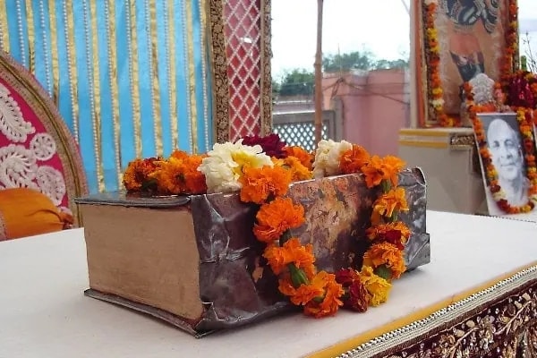 A time-worn holy scripture on a dais in India