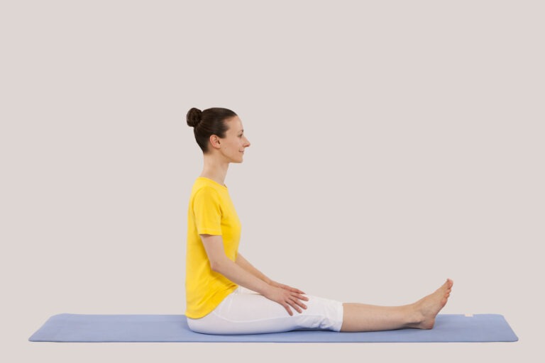 Step 1 of Half Spinal Twist for beginners