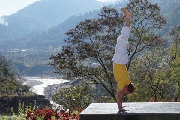 Handstand with the Ganges in the background